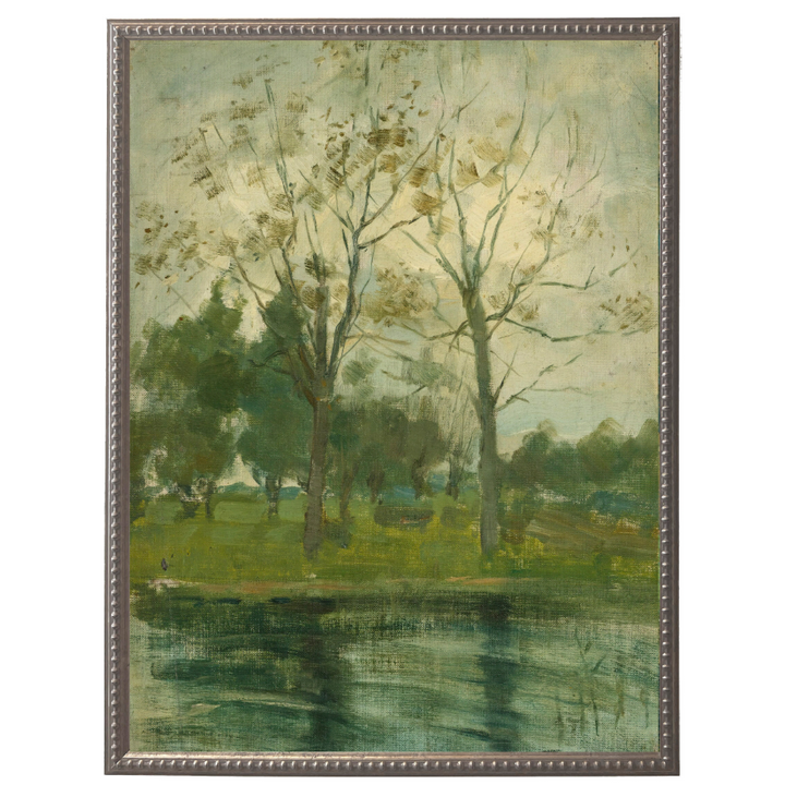 Two Trees Silhouetted Behind A Water Course